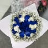 Bouquet of blue and white roses wrapped in white paper