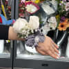 White rose wrist corsage with gray ribbon and small baby's breath