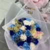 Bouquet of blue and white roses with butterfly picks