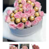 Pink roses arranged with gold-wrapped chocolates in a round box