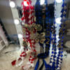 Decorative ribbon garlands with 2024 numbers and dollar-bill bows