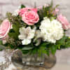 A perfectly pretty bouquet of large roses, spray roses, big white carnations