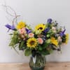 A cheerful collection of yellow and blue flowers designed in a playful