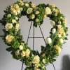 Soft yellows paired with green and white flowers beautifully designed in an
