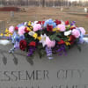 Colorful floral arrangement on a cemetery monument