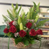 Bright and comforting basket. Roses and lilies are a beautiful mix.