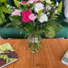 Mixed pink and white carnations in a clear glass vase