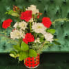 a mixture of berries, red and white roses, red and white carnations