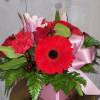 Roses, Oriental lilies, Gerber Daisy, and Carnations in a square vase