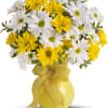 Bouquet of white and yellow daisies in a yellow vase with a gingham ribbon