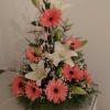 Hermoso arreglo floral con Gerberas Lilies  nuve y Leather una combinacion