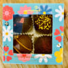 Box of four decorated chocolates in a floral spring-themed package