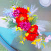 Colorful flower crown with red, pink, yellow, and lavender blooms