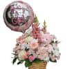 Pink flower basket with a teddy bear and a balloon reading "It's A Girl"