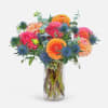 Colorful dahlia bouquet in a clear glass vase