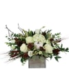 White roses and hydrangeas in a square vase with pinecones