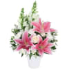 Pink lilies and white roses in a white vase