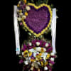 Heart-shaped purple and yellow floral arrangement with a mixed bouquet below