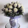  Experience the beauty of this exquisite bouquet featuring vibrant purple statice