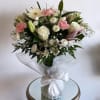 Perfect arrangement of all-white blooms with some subtle hints of pink! 