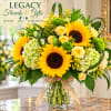 Sunflower and rose arrangement in a glass vase with a burlap ribbon