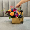 Flower gift bag with roses and a drink bottle