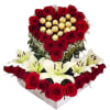 Heart-shaped rose arrangement with lilies and chocolates in a white box