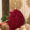 Large bouquet of red roses with long stems tied together