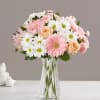 Pink and white mixed bouquet in a clear glass vase