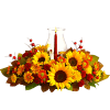 Autumn floral centerpiece with sunflowers and a candle in a glass hurricane