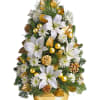 White lilies and gold ornaments arranged in a gold vase