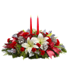 Holiday centerpiece with white lilies, red carnations, and two red candles