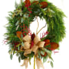 Evergreen wreath with red berries and a burlap bow