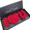 Red roses arranged in a black gift box with "DEEP LOVE" text