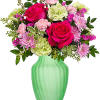 Pink roses and mixed flowers in a green vase