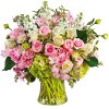 Pink and white roses with alstroemeria in a glass vase