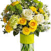 Yellow and white rose bouquet in a clear glass vase