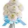 White chrysanthemum bouquet tied with a blue ribbon