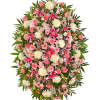 Large standing spray of pink and white flowers with green foliage