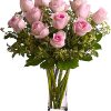 Bouquet of pale pink roses in a clear glass vase
