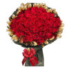Large bouquet of red roses with gold-toned leaves and a red ribbon