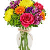 Mixed bouquet of roses, gerbera daisies, and alstroemeria in a glass vase