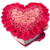 Heart-shaped box filled with pink and red roses