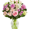 Pink and white mixed bouquet in a clear glass vase