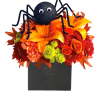 Halloween floral arrangement with a black spider topper in a black box