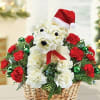 White teddy bear floral arrangement in a basket with red roses and a Santa hat