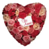 Heart-shaped rose arrangement with a "Te Amo" card