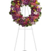 Colorful floral wreath on a white easel