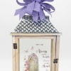 A gently glowing wooden lantern crafted as a heartfelt sympathy gift, the