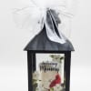 Black memorial lantern with a white bow and "In loving Memory" design